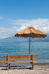 Greek beach with empty bench