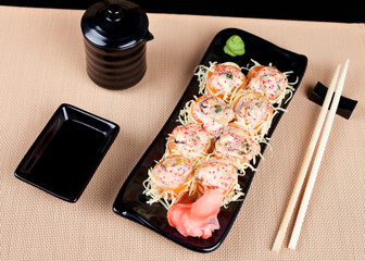Table place setting with sushi roll