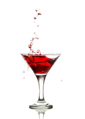 red martini cocktail splashing