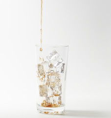 Glass of cola with ice cubes