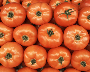 vivid red tomatoes closeup, background