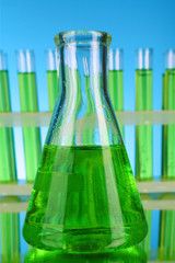 Laboratory glassware on blue background