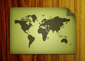 world map on wooden background