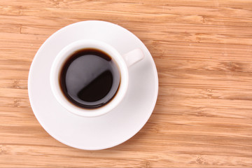 Coffee cup on wooden surface