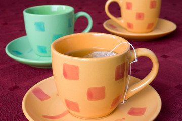 three cups of tea on the table