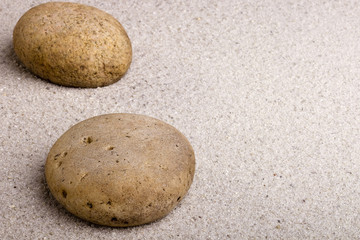 Fototapeta na wymiar Stone on the Sand