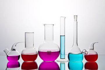 laboratory glassware with colorful chemicals