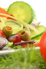 Composition with vegetable salad with olives.