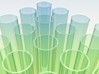 light blue and green laboratory test tubes on white background