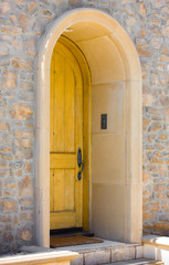 Fototapeta na wymiar Wood Door on Pretty Stone House