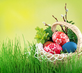 Colorful painted easter eggs in basket