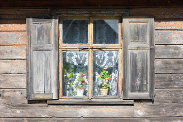 Window of an old house with flowers