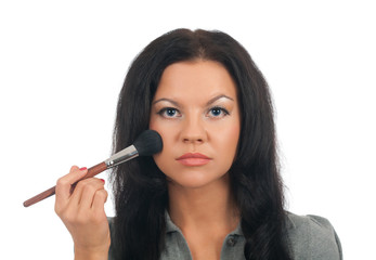 Obraz premium putting on models eye make up.