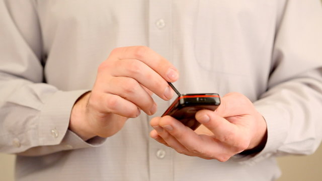 Hands and mobile phone