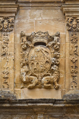 Carved stone coat of arms