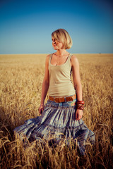 Image of young woman on wheat field
