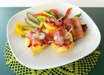 potato rolled and baked with bacon,paprica and gorgonzola cheese