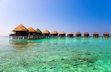 Maldives.Villa on piles on water .