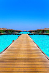 Maldives. A wooden road over ocean
