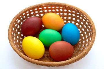 Easter  painted eggs in webbed wooden plate