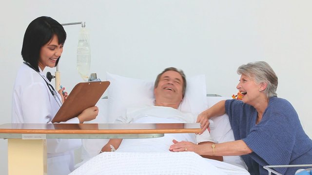 Couple receiving a visit of the nurse