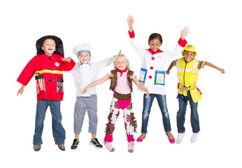 Obraz premium young kids in various uniforms jumping on white