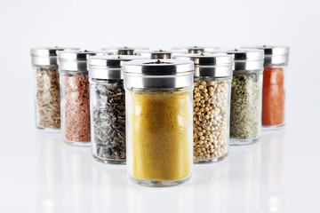 spices in glass bottles