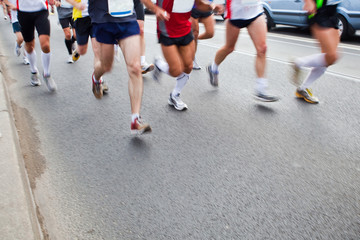 People running in city marathon