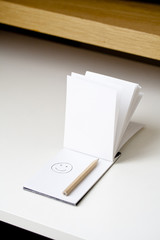 Smiley sur un carnet