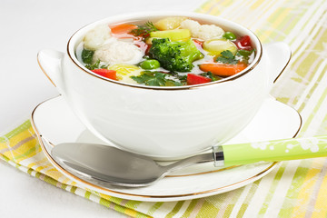 Soup with chicken meatballs and fresh vegetable