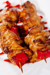 grilled meat on the plate with spicy sauce