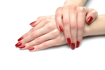 Beautiful hand with perfect nail red manicure isolated on white