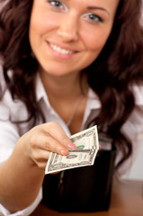 Young woman hand holding one dollar