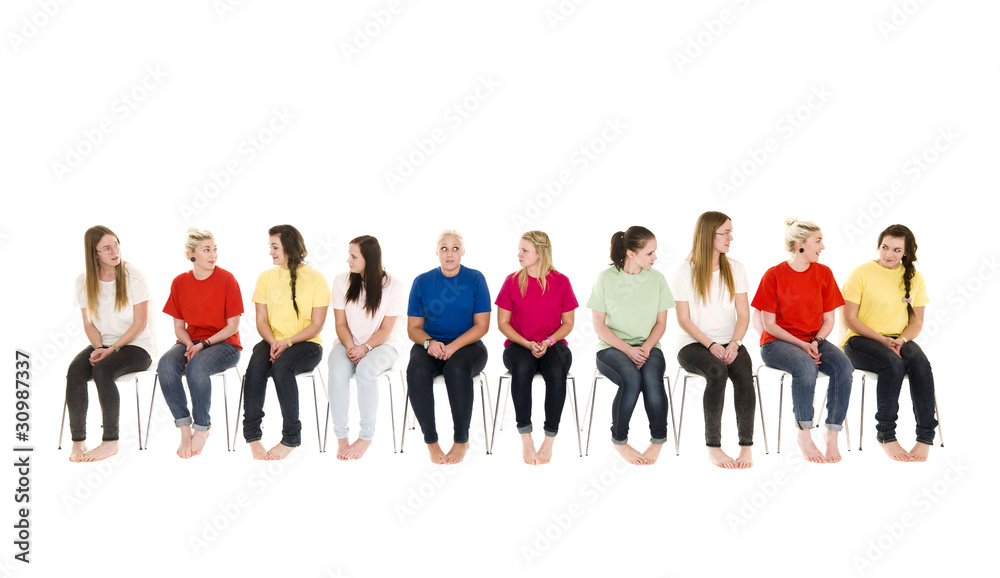 Wall mural Group of Young women on chairs