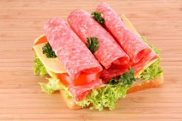 Sandwich on wooden plate