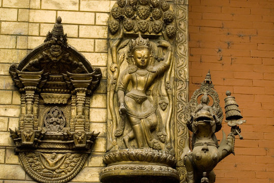 Bronze  Deity at wall in Nepal temple 1.
