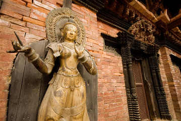Bronze Deity  front of temple at Patan Durbar Square, Nepal.