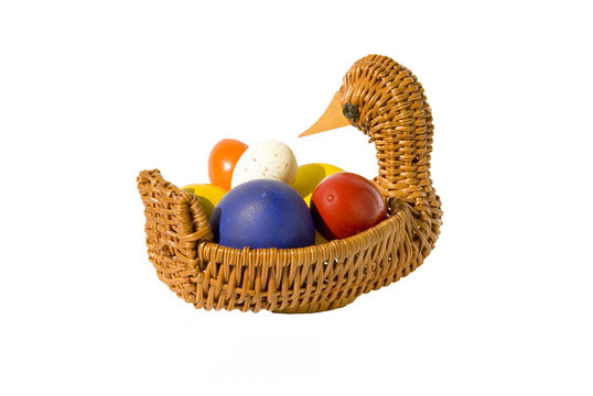 isolated color Easter eggs in basket