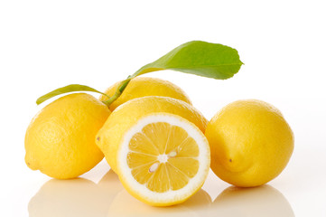 lemons and leaves on white background