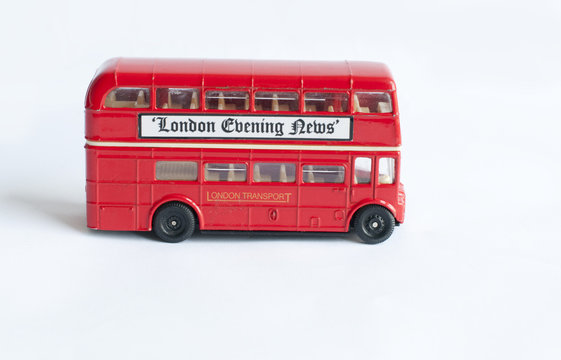 childs toy double decker red london bus on white background