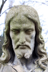 Fototapeta premium Jesus Face on the old Prague Cemetery, Czech Republic