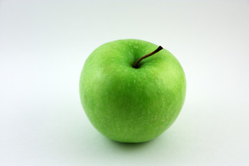 A green apple isolated on a white background
