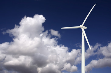 Wind Turbine Over Dramatic Sky and Clouds