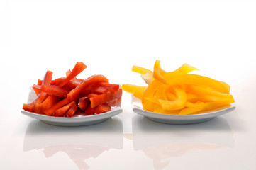 yellow pepper and red pepper strips on a dish