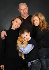 Family on a black background