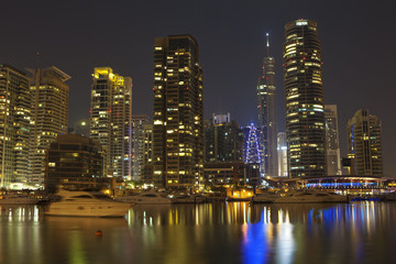 Obraz na płótnie Canvas Town scape at night time. Panoramic scene, Dubai.