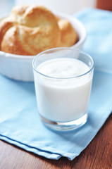 Cup of yogurt and a freshly baked bread for breakfast