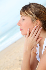 Portrait of beautiful blond woman at the beach