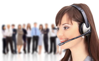 Woman wearing headset in office; could be receptionist.