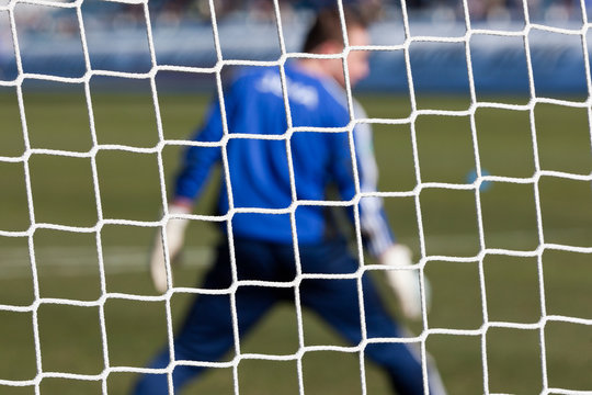 Football soccer goal net with grass background